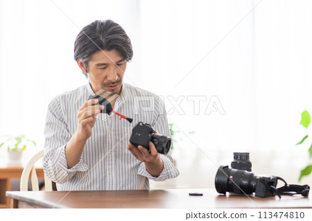 A man who takes care of the camera 113474810