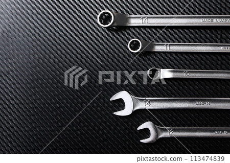 Wrench and spanner placed on the carbon stand 113474839