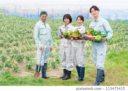 Smiling farmer and young people looking at each other 113475415