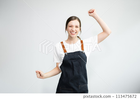 Woman entrepreneur or shop owner. Isolated small business owner or barista with apron on white background. Woman entrepreneur or shop owner. Isolated small business owner or barista with apron on white background. 113475672