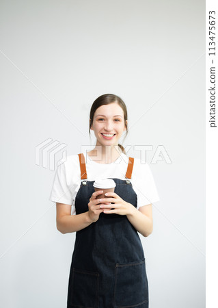 Woman entrepreneur or shop owner. Isolated small business owner or barista with apron on white background. Woman entrepreneur or shop owner. Isolated small business owner or barista with apron on white background. 113475673
