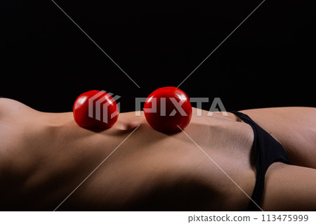 Female with tomatoes on her chest and back, concept of healthy food and female health 113475999