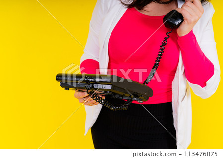 Photo of plump lady talking retro phone empty space isolated yellow color background Photo of plump lady talking retro phone empty space isolated yellow color background 113476075