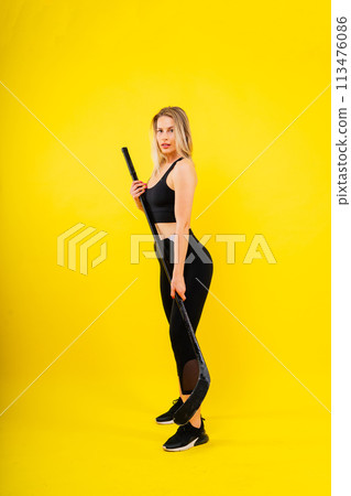 Luxuriously dressed female with a hockey stick. Women's winter sports. 113476086
