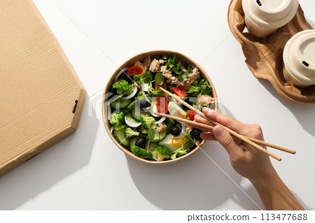 Tuna salad in a cardboard plate on a light table. 113477688