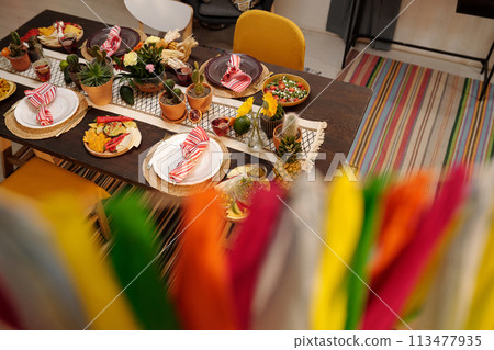Table served with festive homemade food Table served with festive homemade food 113477935