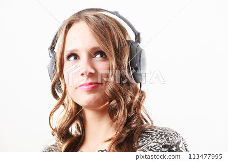 woman in headphones listening music mp3 relaxing 113477995