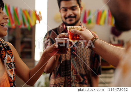 Friends making toast with tequila 113478032