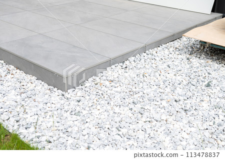 Modern Grey Tile Ramp with White Gravel 113478837