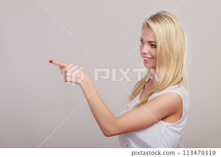 woman showing copy space pointing with finger woman showing copy space pointing with finger 113479319