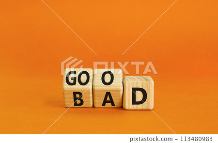 Good or bad symbol. Turned wooden cubes and changed the word bad to good. Beautiful orange table, orange background, copy space. Business and bad or good concept. Good or bad symbol. Turned wooden cubes and changed the word bad to good. Beautiful orange table, orange background, copy space. Business and bad or good concept. 113480983