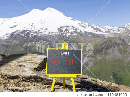 Pay yourself first symbol. Concept words Pay yourself first on beautiful black chalk blackboard. Beautiful mountain Elbrus background. Business and pay yourself first concept. Copy space. Pay yourself first symbol. Concept words Pay yourself first on beautiful black chalk blackboard. Beautiful mountain Elbrus background. Business and pay yourself first concept. Copy space. 113481033
