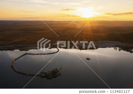 Sand mining platform on the water. Aerial view of an industrial landscape. 113481127