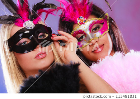 Two women with carnival venetian masks Two women with carnival venetian masks 113481831