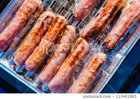 Sausages meat grilling on gas grill Sausages meat grilling on gas grill 113481865