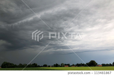 Ominous Storm Clouds Gathering Over Rural Landscape Ominous Storm Clouds Gathering Over Rural Landscape 113481867