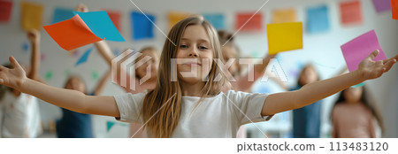 Caucasian girl smiling happily at classroom party. Caucasian girl smiling happily at classroom party. 113483120