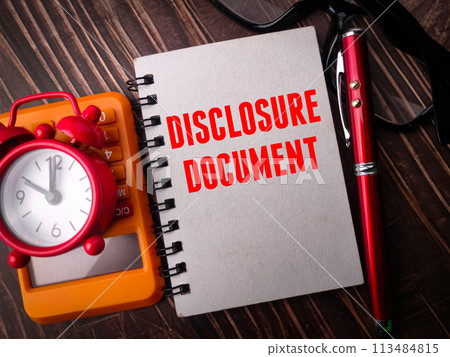 Clock,calculator,pen and notebook with text DISCLOSURE DOCUMENT on wooden background 113484815