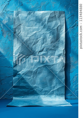 A piece of paper is sitting on a blue wall, AI 113484880