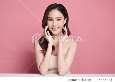 Beautiful young asian woman with clean fresh skin on pink background, Face care, Facial treatment, Cosmetology, beauty and spa, Asian women portrait. 113485441