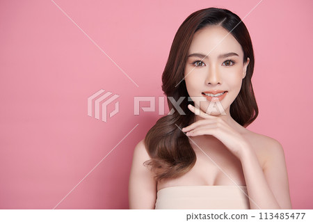 Beautiful young asian woman with clean fresh skin on pink background, Face care, Facial treatment, Cosmetology, beauty and spa, Asian women portrait. 113485477