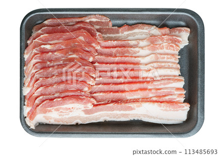 Raw pork streaky brisket bacon in black plastic pack isolated on white background 113485693