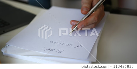 Male hand hold silver pen composing to do list Male hand hold silver pen composing to do list 113485933