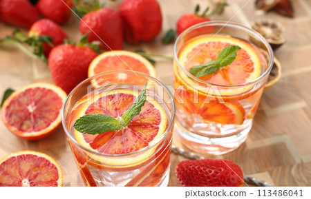 Red orange punch home made cocktail closeup 113486041