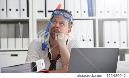 Man wearing suit and tie in goggles with snorkel 113486042
