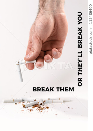 The concept of nicotine addiction and anti-Smoking. A man's hand holds a cigarette broken in half, at the bottom are the fragments of cigarettes. White background. Break them or they'll break you The concept of nicotine addiction and anti-Smoking. A man's hand holds a cigarette broken in half, at the bottom are the fragments of cigarettes. White background. Break them or they'll break you 113486400