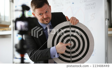 Male millennial vlogger hold target darst Male millennial vlogger hold target darst 113486449