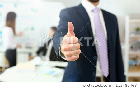 Male arm show OK or confirm during conference in office 113486468