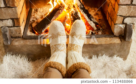 Feet of Unrecognizable Woman in Woollen Socks by the Fireplace - Generative Ai 113488866
