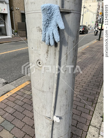 Gloves on a Japanese utility pole 113489895