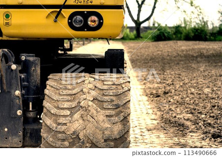 tractor tire tracks in the field tractor tire tracks in the field 113490666