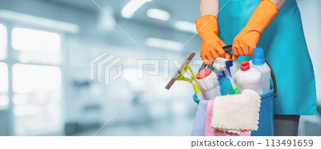 Cleaning woman with bucket on blurred background. 113491659