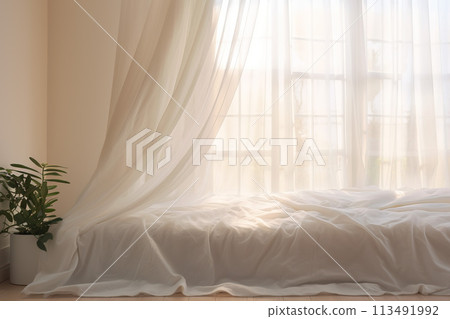 White bedroom with bed covered soft white blanket. Sunny morning in bedroom with big window and green plant 113491992