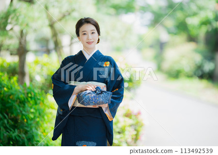 A woman wearing a formal kimono A woman wearing a formal kimono 113492539