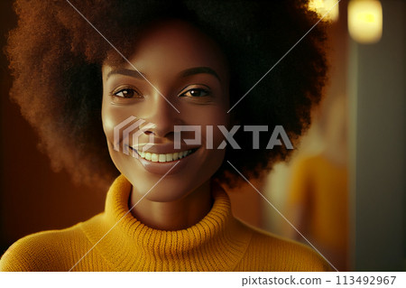 African American young woman with afro hair smiling in a yellow sweater. Beautiful woman standing 113492967
