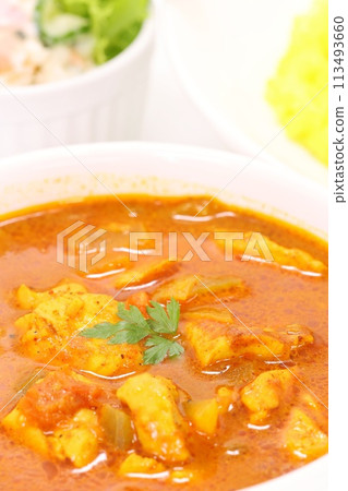 Nepalese chicken curry soup curry yellow rice light background 113493660