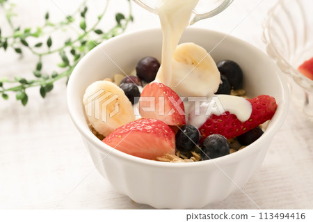 Granola, cereal, soy milk, strawberries, blueberries, bananas 113494416