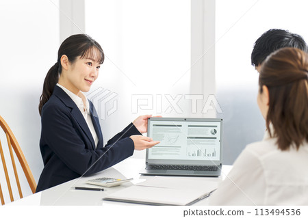 Businesswoman giving information about insurance Businesswoman giving information about insurance 113494536