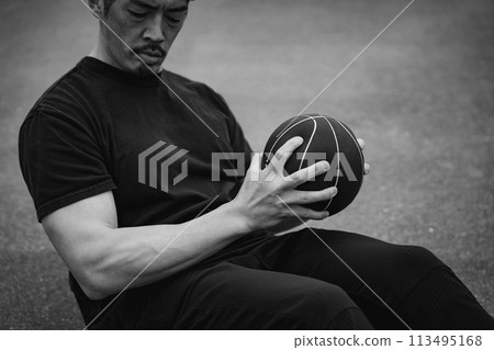 A man in his 40s doing strength training outdoors A man in his 40s doing strength training outdoors 113495168