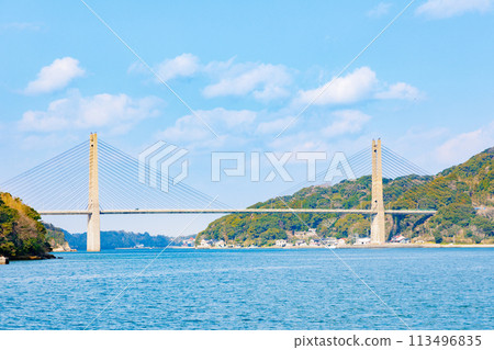 Yobuko Bridge and the calm sea with blue skies 113496835