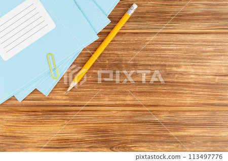 Wooden school desk with educational supplies. 113497776