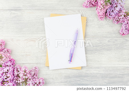 Notebook with pen and lilac. 113497792