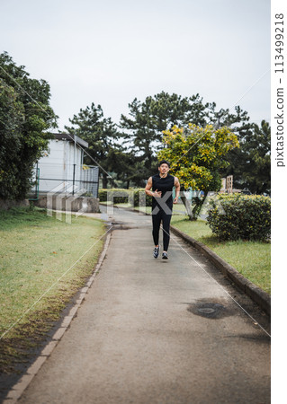 A man in his 40s jogging 113499218