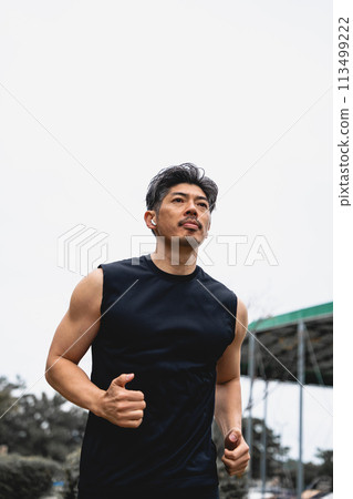 A man in his 40s jogging 113499222