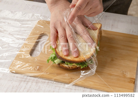 Sandwich making process Wrapping in plastic wrap Sandwich making process Wrapping in plastic wrap 113499582