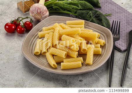 Italian cuisine - cooked pasta tortiglioni Italian cuisine - cooked pasta tortiglioni 113499899